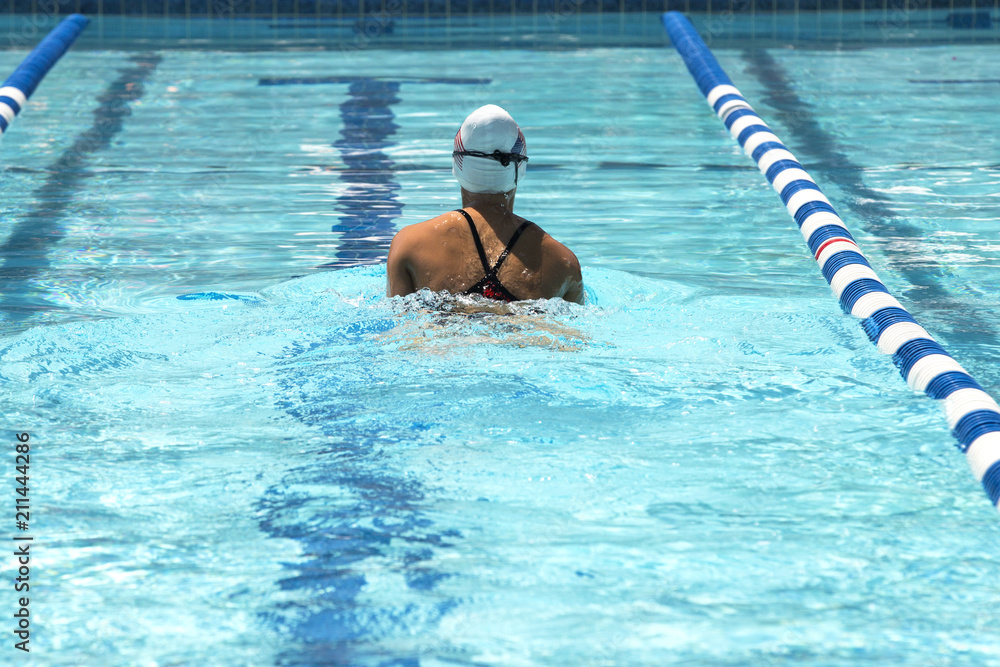 Teen female swimmer at a swim meet