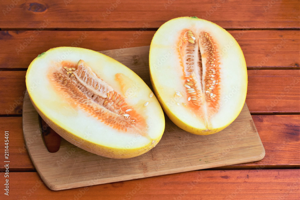Melon cut in half, fresh raw melon texture. Melon cut in half, fresh raw melon texture.