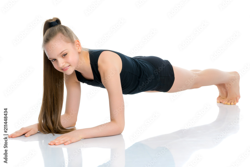 The gymnast perform an acrobatic element on the floor. The gymnast perform an acrobatic element on the floor.