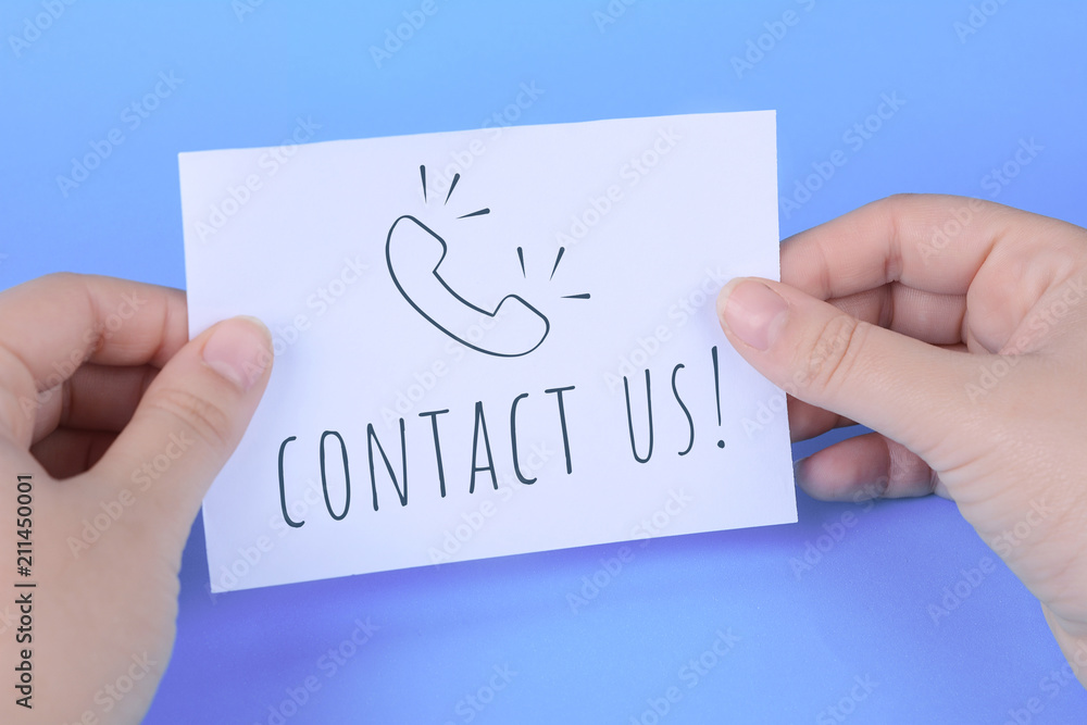Woman's hand holding card with words Woman's hand holding card with words