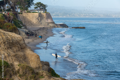 surfers on beach in Santa Cruz