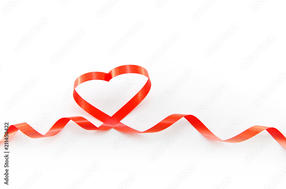 The concept of Valentine's Day: heart made of red ribbon The concept of Valentine's Day: heart made of red ribbon