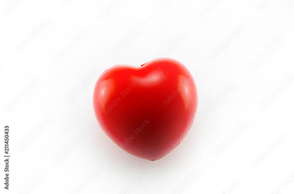 Valentine's Day concept: a red heart on the white background Valentine's Day concept: a red heart on the white background