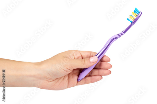 Color new toothbrush with hand isolated on a white background.