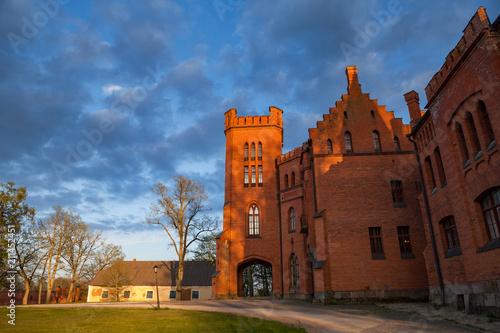 Old red brick manor house in the style of English castles. Sangaste, Estonia.