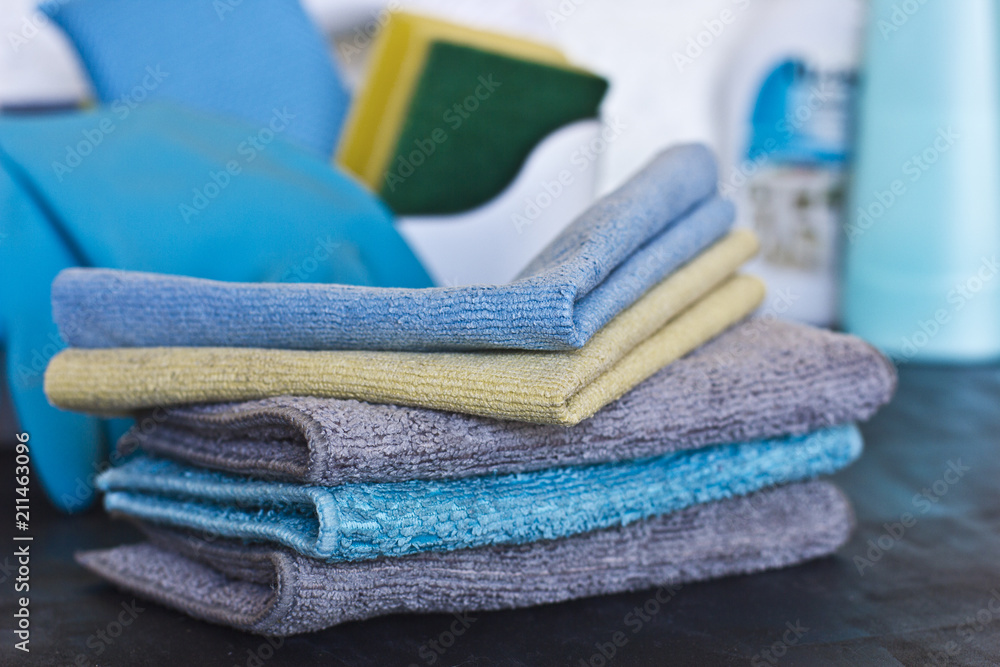 Cleaning stuff. Blue and grey microfiber napkins on black ground Cleaning stuff. Blue and grey microfiber napkins on black ground
