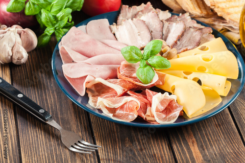 Cold meat platter with ham, prosciutto, bacon and cheese