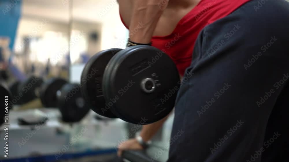 Muscular man doing crossfit training in gym holding. Fitness concept, movement round close shot Muscular man doing crossfit training in gym holding. Fitness concept, movement round close shot