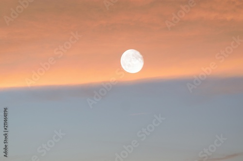 Nature background of shining full moon in dusk sky