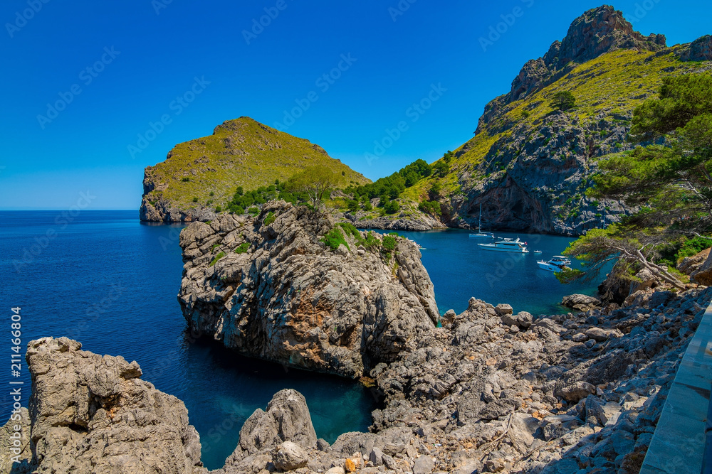 Fototapeta premium A rugged coast on a sunny summer day without clouds in Majorca, Spain 2018