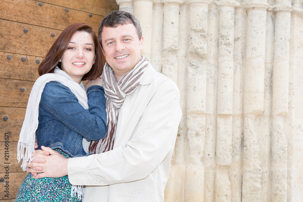 tourist couple in love during vacation in France in old ancient village