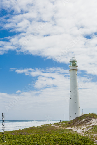 Lighthouse on a rugged coastline during the daytime