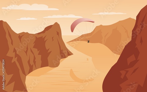 A flying paratrooper on the background of a river and mountains