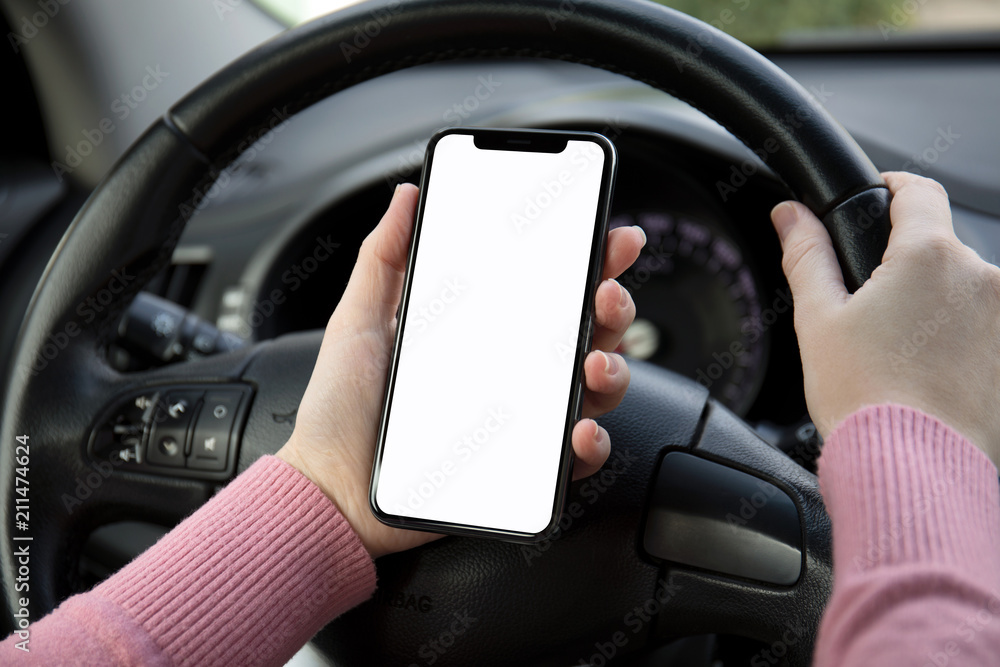 women hands holding phone with isolated screen in the car