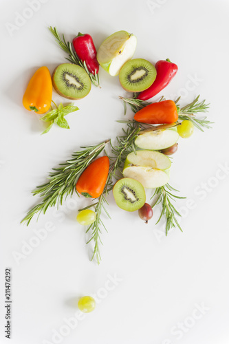 Colorful question mark of vegetables and fruits on white background