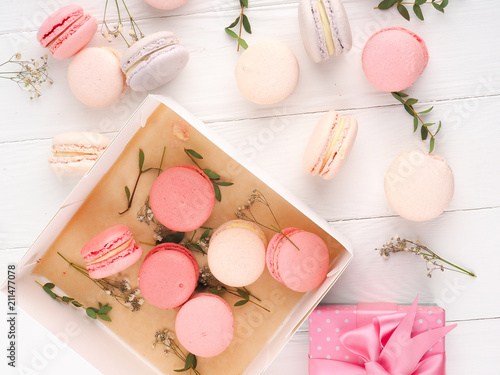 Colorful macaroons, Colorful french dessert, traditional french colorful macarons in a rows in a box photo