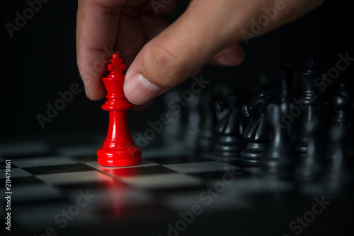 man hand playing chess board, concept of business strategy and tactic