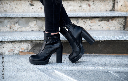 Woman wearing black boots