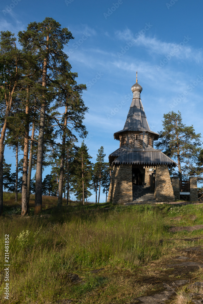 The entrance to the stone chapel with a porch. Valaam is a cozy and quiet piece of land, the rocky shores of which rise above the lush waters of lake Ladoga The entrance to the stone chapel with a porch. Valaam is a cozy and quiet piece of land, the rocky shores of which rise above the lush waters of lake Ladoga