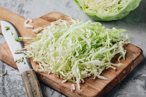 Fresh green cabbage cut. Sliced cabbage on the cutting board photo