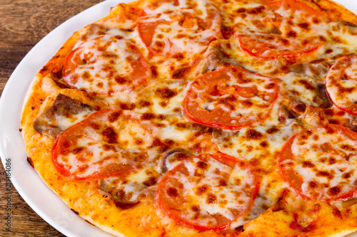 Pizza with beef and tomato