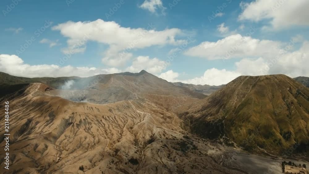 Crater with active volcano smoke in East Jawa, Indonesia. Aerial view of volcano crater Mount Gunung Bromo is an active volcano,Tengger Semeru National Park. 4K video. Aerial footage. Crater with active volcano smoke in East Jawa, Indonesia. Aerial view of volcano crater Mount Gunung Bromo is an active volcano,Tengger Semeru National Park. 4K video. Aerial footage.