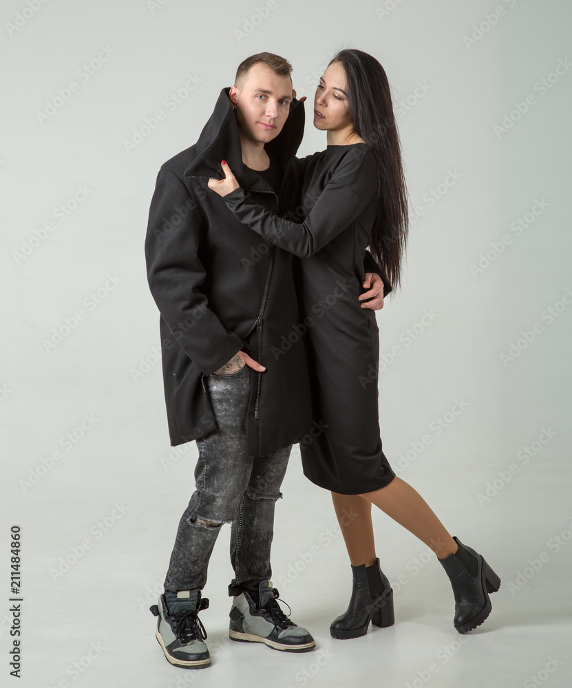 Φωτογραφία Man and woman are fashion models in dark clothes. Couple.