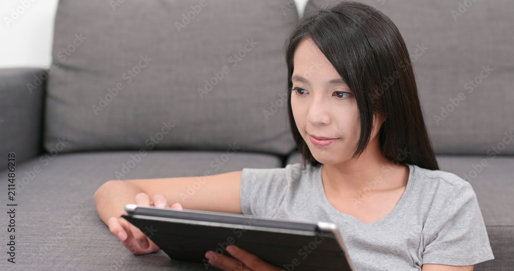 Woman use of tablet computer at home Woman use of tablet computer at home
