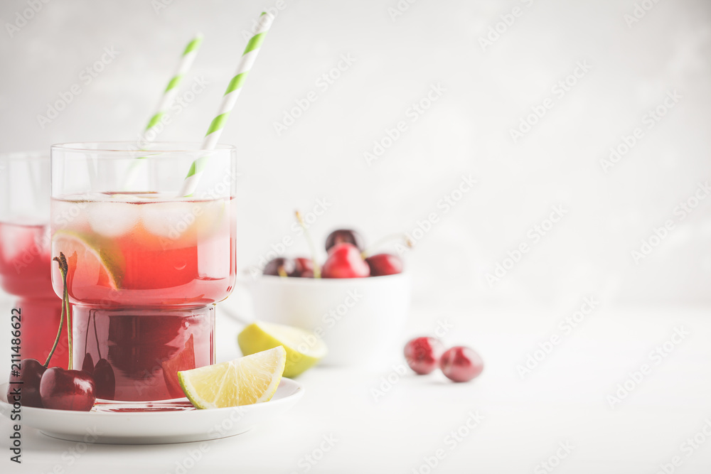 custom made wallpaper toronto digitalCherry juice with ice and lime in a glass beaker, light background. White background.
