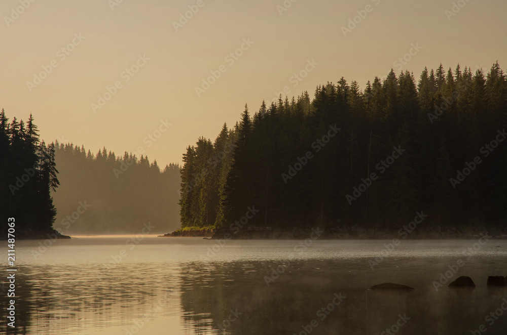 Fototapeta premium Magic sunrise by the dam lake in Rhodope mountain, Bulgaria. 