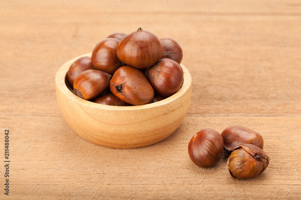 chestnut in wooden bowl chestnut in wooden bowl