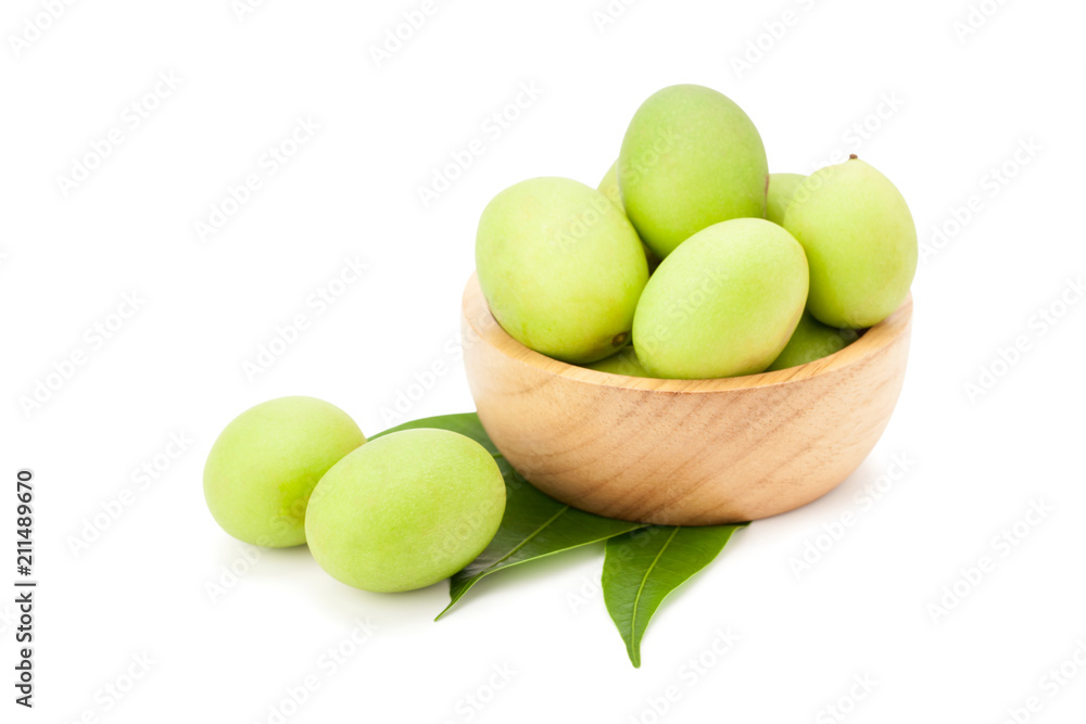 Plum Mango or Marian Plum fruits (Bouea macrophylla Griffith) in wooden bowl Plum Mango or Marian Plum fruits (Bouea macrophylla Griffith) in wooden bowl
