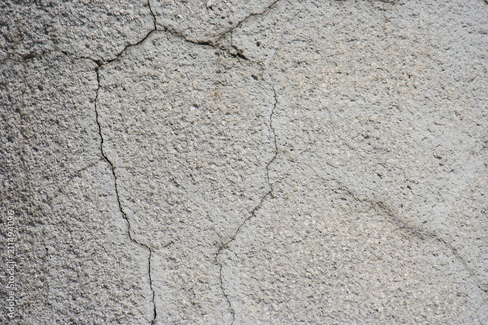 Light gray plaster with cracks. Beautiful wall texture Light gray plaster with cracks. Beautiful wall texture