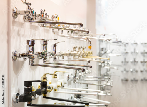 Rows of new faucets for bathroom in plumbing shop