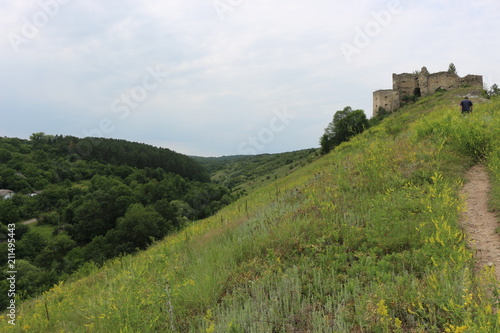  Landscapes with a view of the ruins of an ancient fortress among the hills.