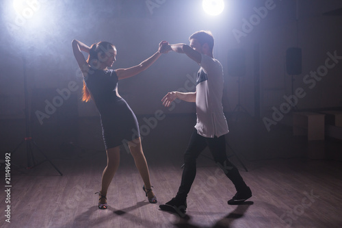 Young love couple dancing social danse kizomba or bachata. © satura_