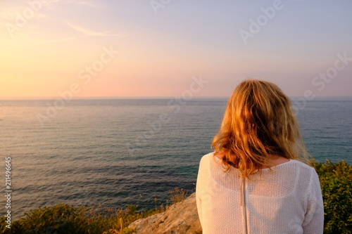 blond girl with ocean