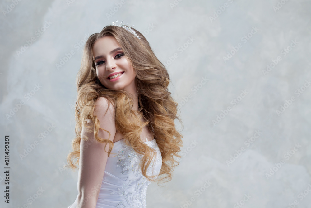 Happy bride laughs. The young woman smiles happily. Beautiful girl is getting married Happy bride laughs. The young woman smiles happily. Beautiful girl is getting married