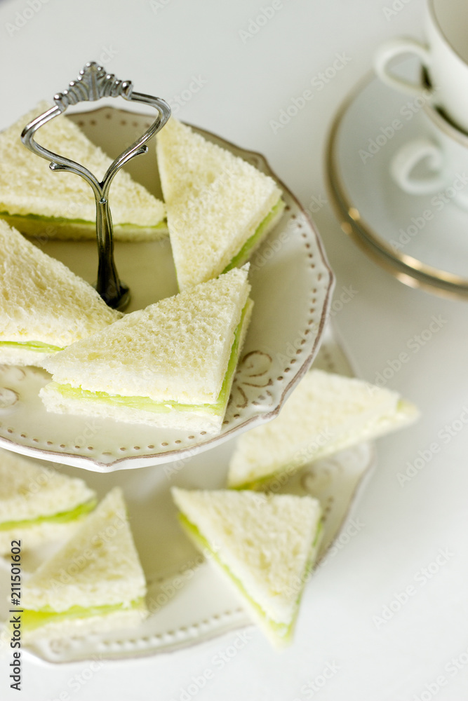 Triangular sandwiches with cucumber and butter for a tea party, English tradition.