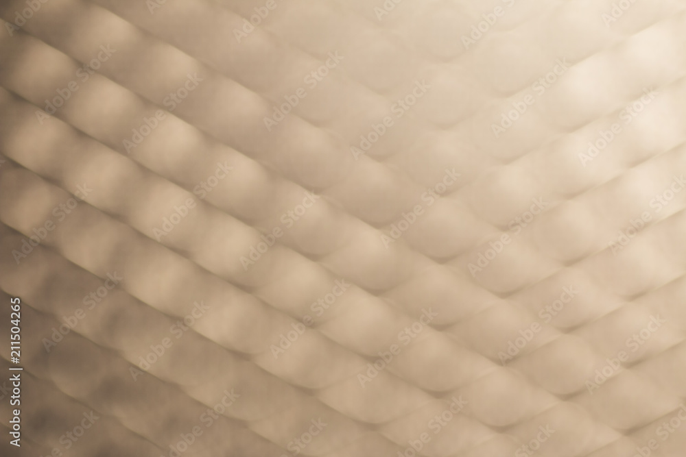 Blurry of metal net as pattern background with light flare Blurry of metal net as pattern background with light flare