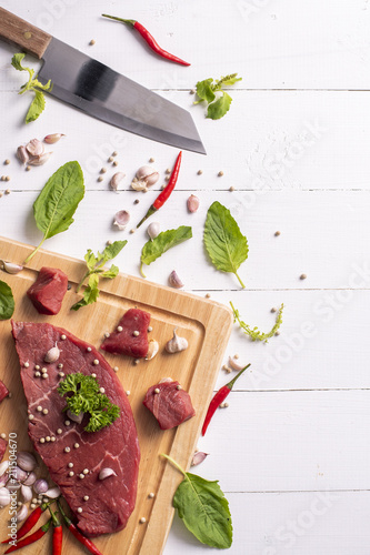 Raw beef on white wood background