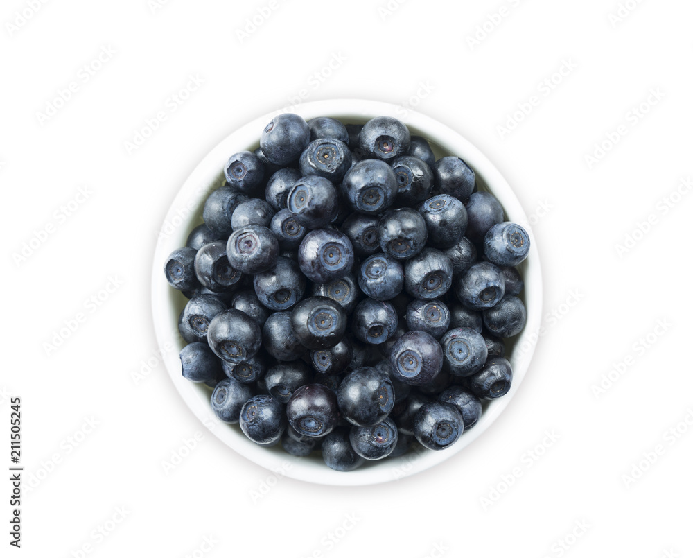 Top view. Bilberres in a bowl isolated on white. Ripe blaeberries with copy space for text. Top view. Bilberres in a bowl isolated on white. Ripe blaeberries with copy space for text.