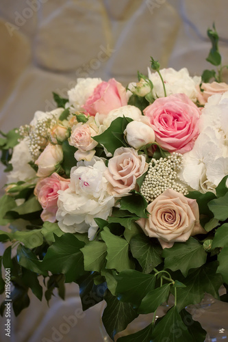 Roses peony flowers bouqet on bamket table.