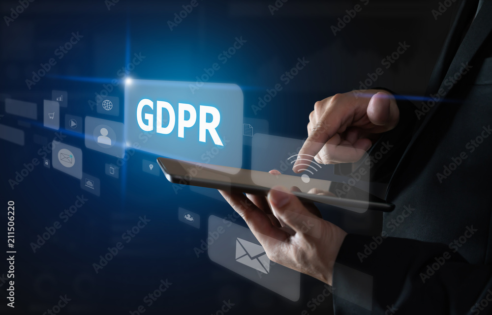 Businessman holding tablet and sign text GDPR (Data Protection Regulation). Cyber security. Businessman holding tablet and sign text GDPR (Data Protection Regulation). Cyber security.