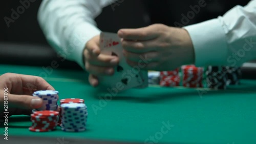 Professional croupier shuffling and dealing cards, strategy, gambling fortune