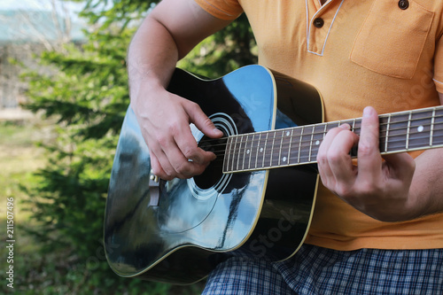 guitar string man hand outdoor