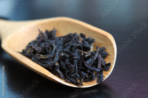 Принти на полотні Black English tea in a wooden spoon on the table
