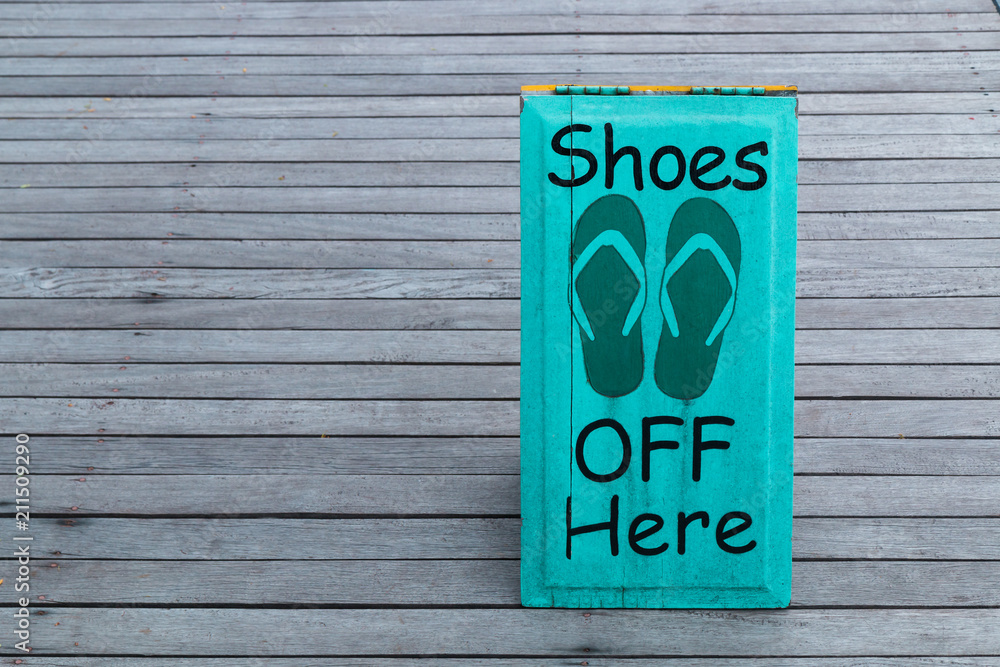 No shoes sign warning on the wooden floor No shoes sign warning on the wooden floor