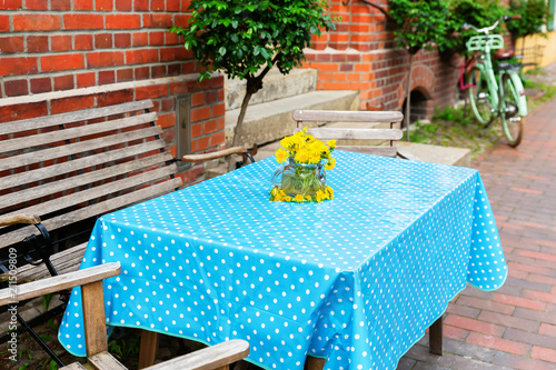 Fototapeta Naklejka Na Ścianę i Meble -  dandelions in a canning jar as table decoration