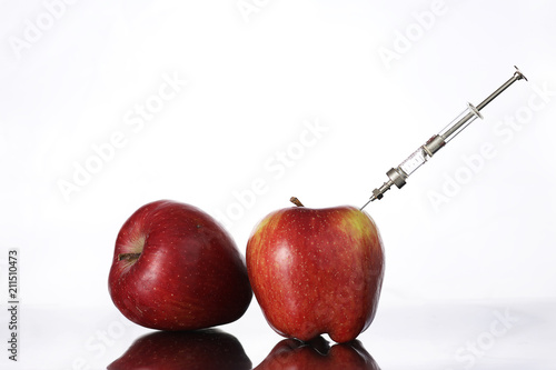 Genetically modified foods, apple pumped with chemicals